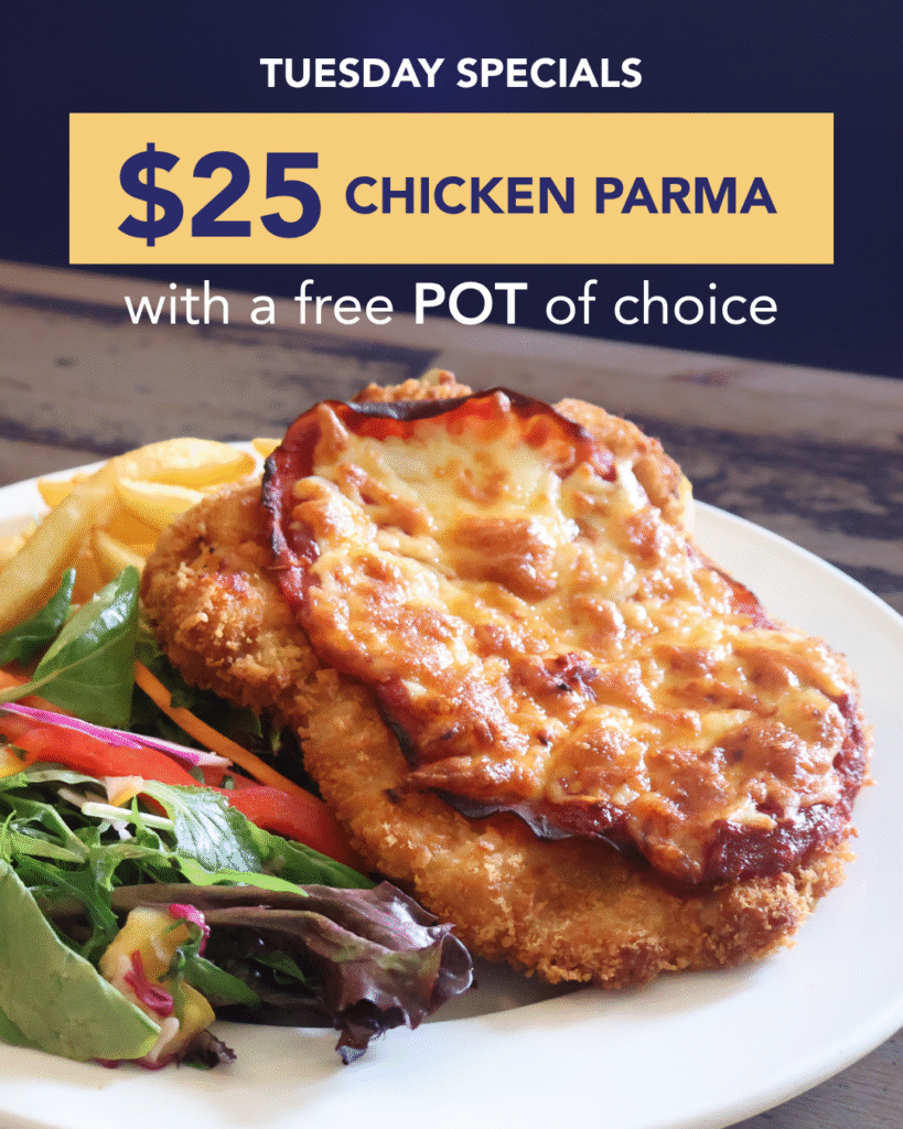 Plate of chicken parma with salad and chips served at The Courthouse Hotel Smythesdale for Tuesday Parma Night special.