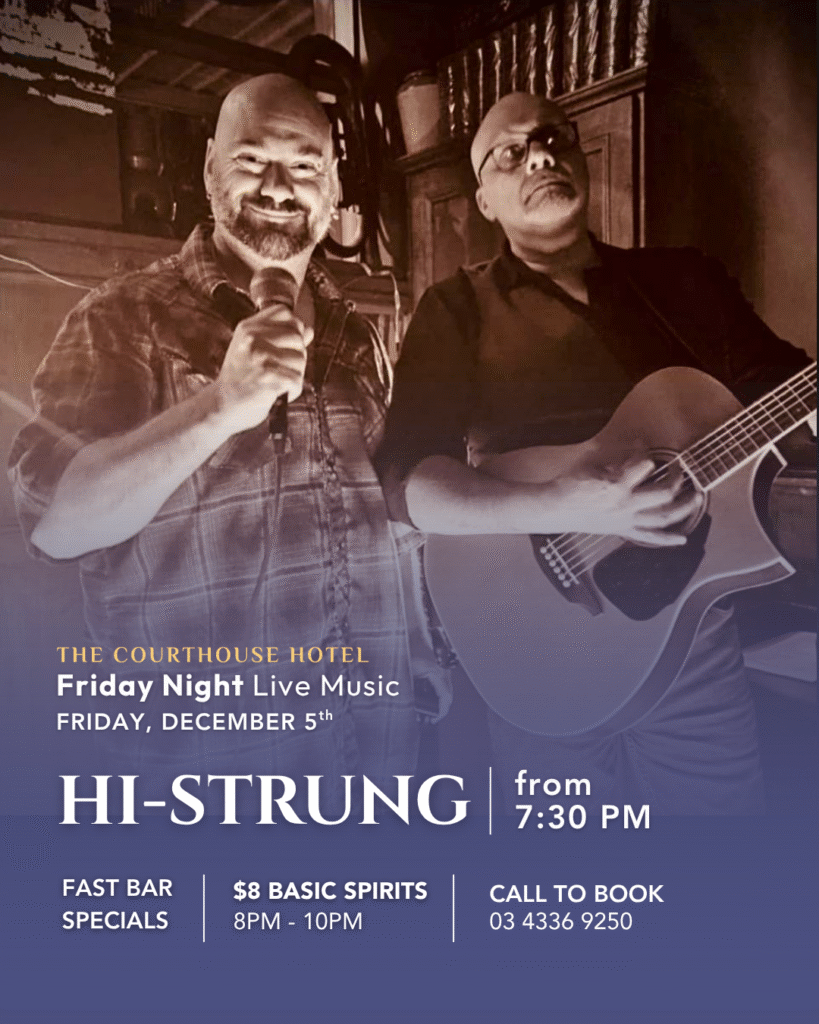 Guitarist and singer performing on stage inside The Courthouse Hotel Smythesdale during Friday Night Live Music.